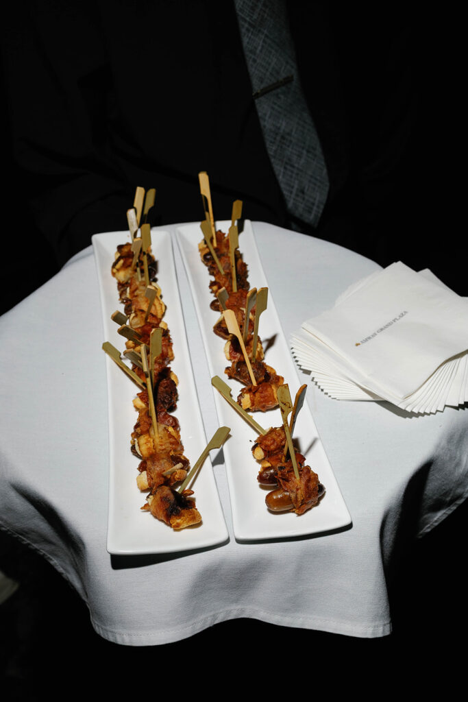 Elegant cocktail hour appetizers served on white platters during Amway Grand Plaza wedding reception