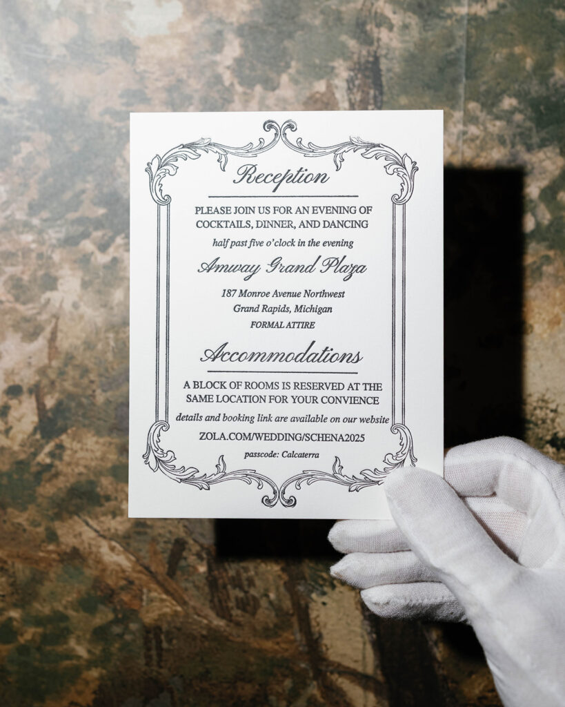 Elegant black and white Amway Grand Plaza reception invitation card with vintage-inspired typography and gloved hand