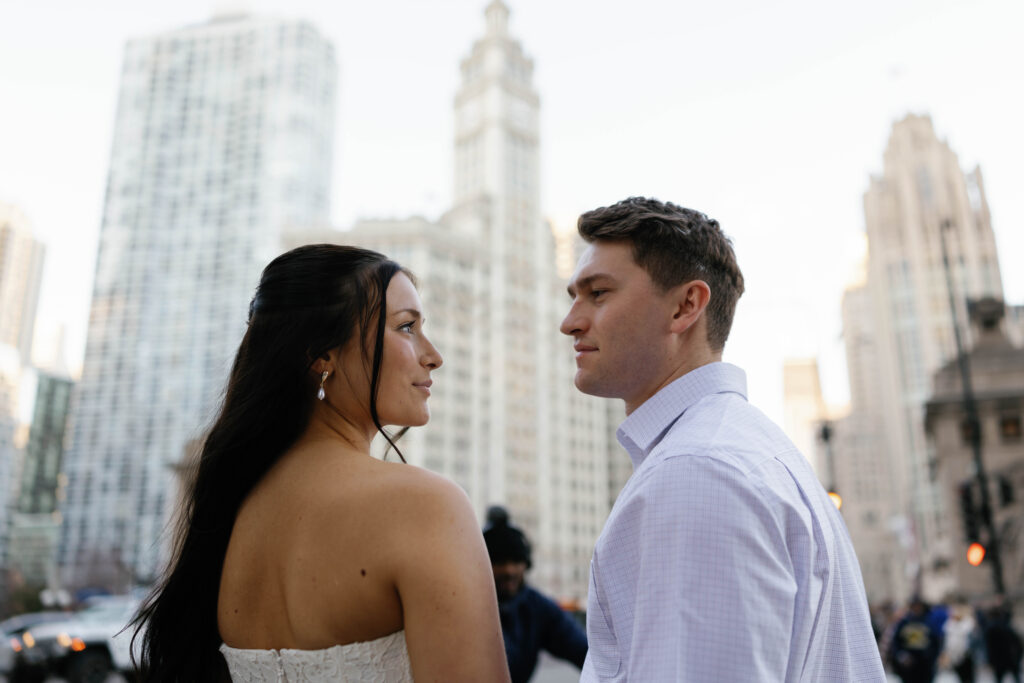 Chicago engagement photos close-up couple gazing at each other downtown city background